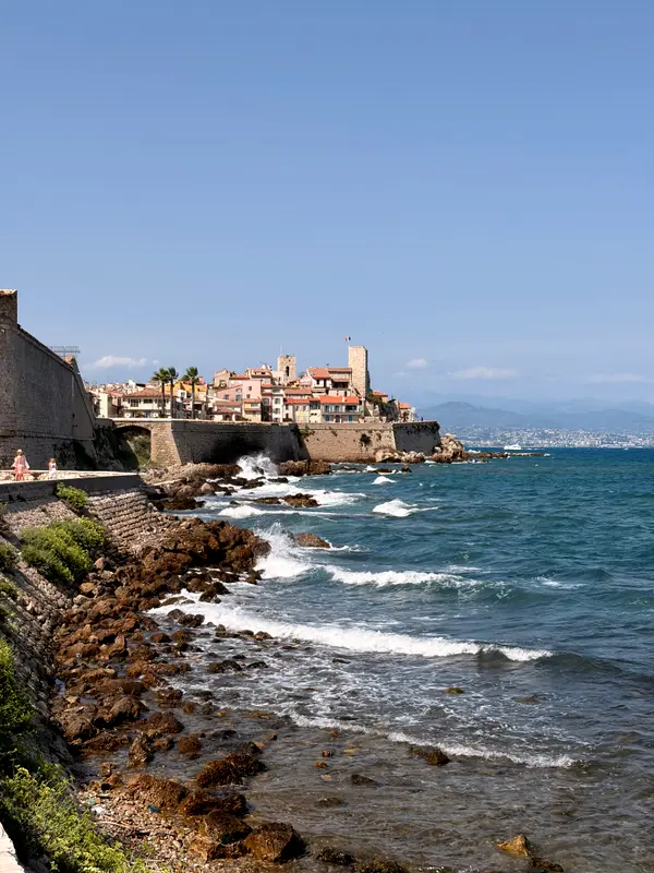 The ramparts at Antibes from the sea wall, swell coming in against the rocks.