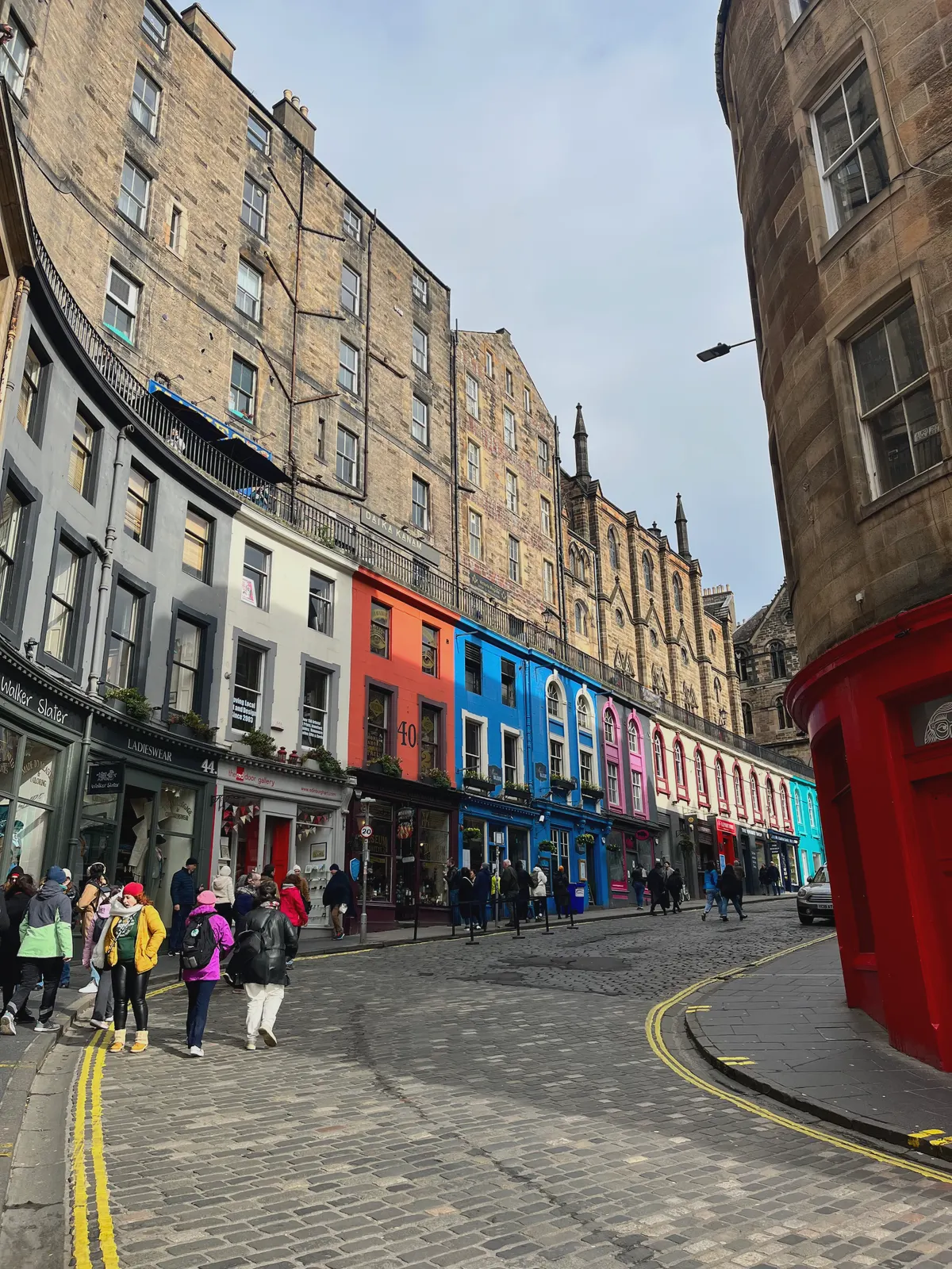 Victoria Street in Edinburgh, the painted shopfronts curving up the hill.