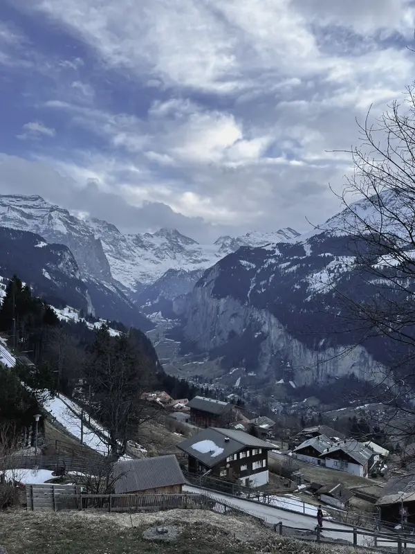 The Lauterbrunnen valley from the hillside above Wengen, cloud breaking up over the far wall.