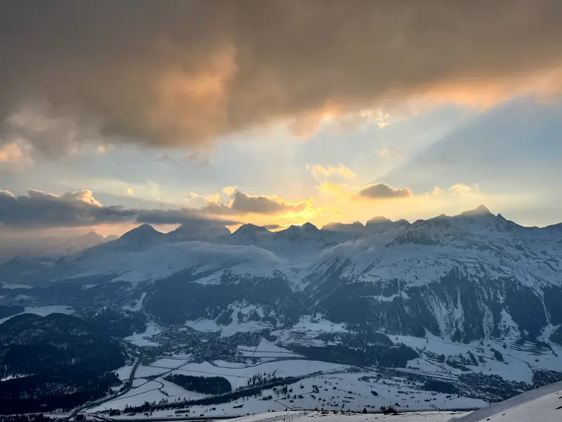 Sunset over the Engadin from the Muottas Muragl funicular, light coming through the cloud.