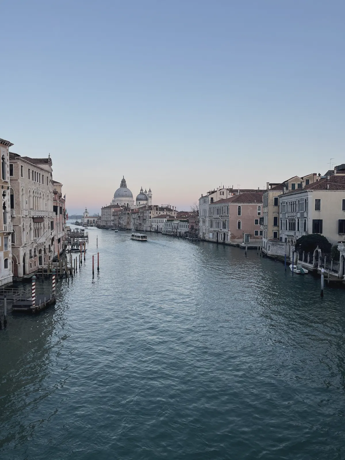 The Grand Canal from a bridge, the dome of the Salute closing the view.