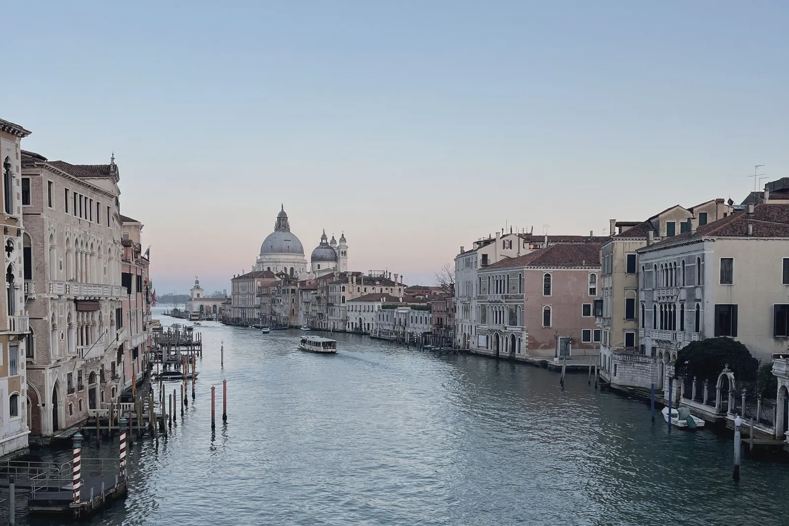 The Grand Canal from a bridge, the dome of the Salute closing the view.